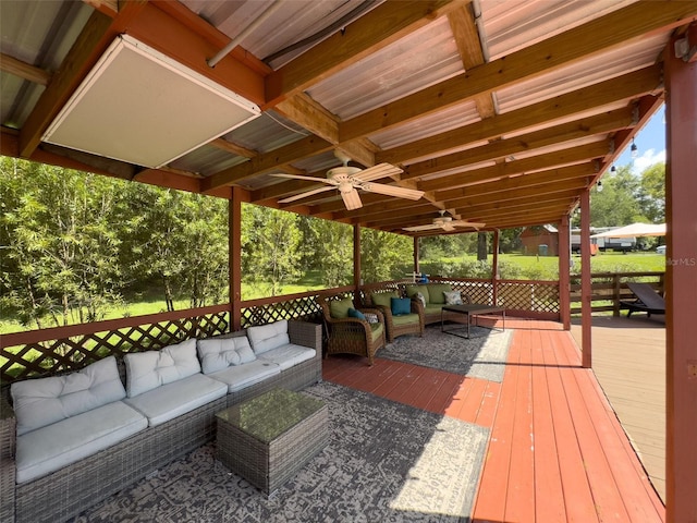 deck featuring an outdoor living space and ceiling fan