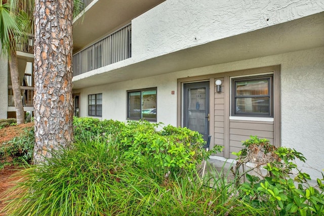 entrance to property with a balcony