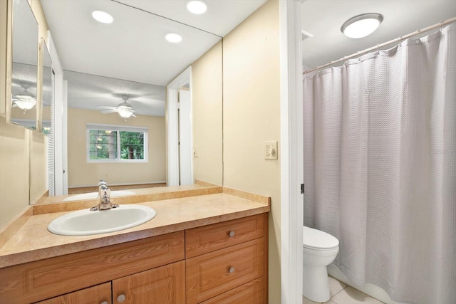 bathroom with vanity, toilet, ceiling fan, and tile patterned flooring