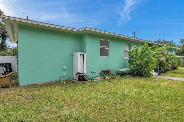 back of house featuring a yard