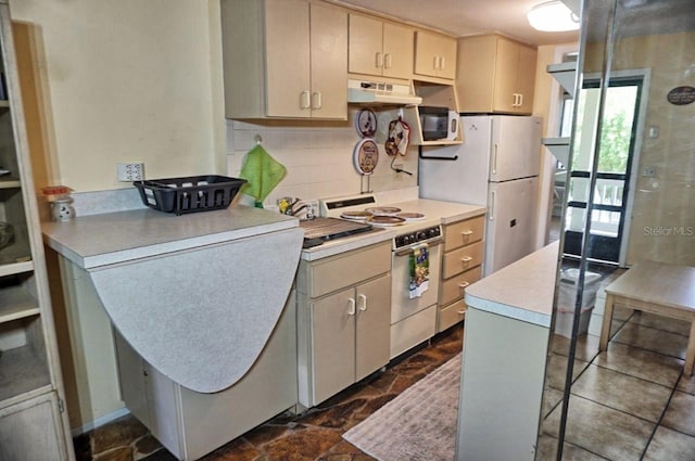 kitchen featuring white appliances and decorative backsplash