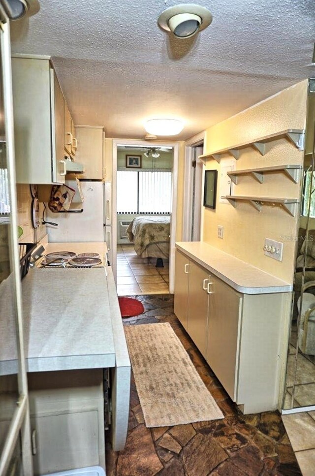 kitchen featuring a textured ceiling