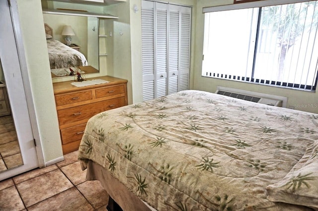 bedroom with light tile patterned floors