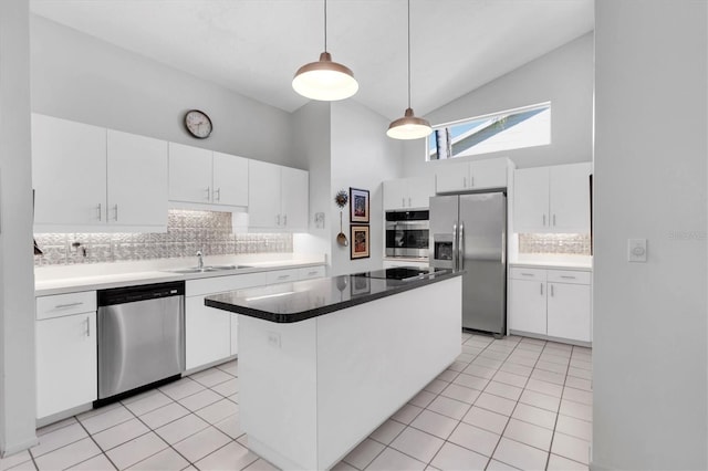 kitchen featuring white cabinets, sink, stainless steel appliances, and high vaulted ceiling