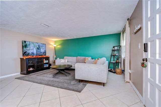 tiled living room with a textured ceiling