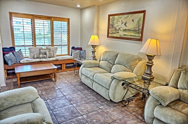 living room with dark tile patterned floors