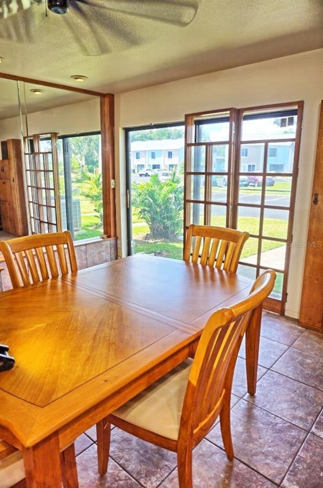 dining room featuring a textured ceiling