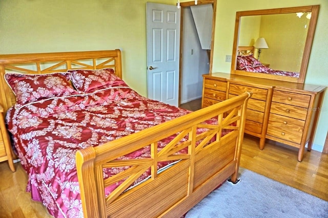 bedroom with wood-type flooring