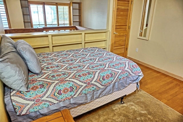 bedroom with hardwood / wood-style floors