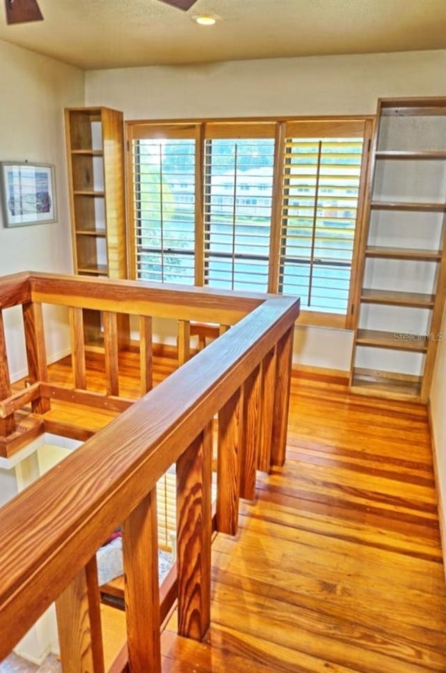 staircase featuring hardwood / wood-style flooring