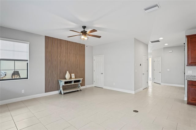 unfurnished living room featuring recessed lighting, baseboards, visible vents, and ceiling fan