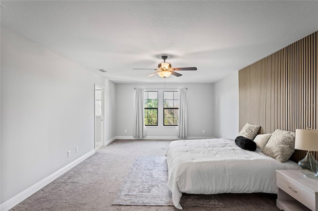 bedroom with visible vents, ceiling fan, baseboards, and carpet