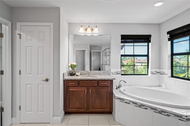 bathroom featuring vanity, a garden tub, tile patterned floors, and walk in shower