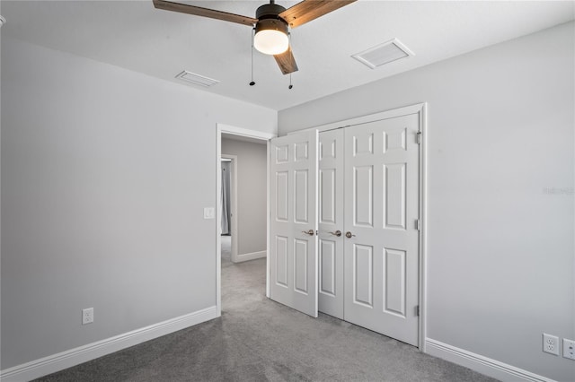 unfurnished bedroom with visible vents, carpet flooring, and baseboards