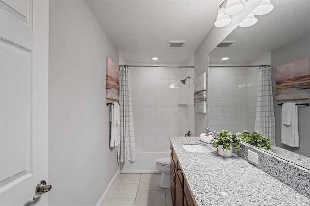 bathroom with tile patterned flooring, toilet, vanity, and visible vents