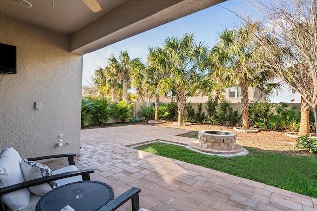 view of patio / terrace featuring fence and an outdoor fire pit