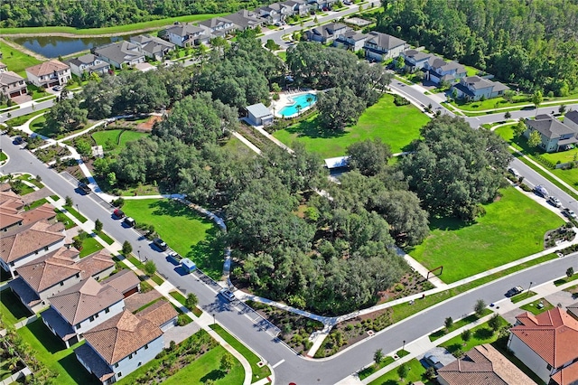 birds eye view of property with a residential view and a water view