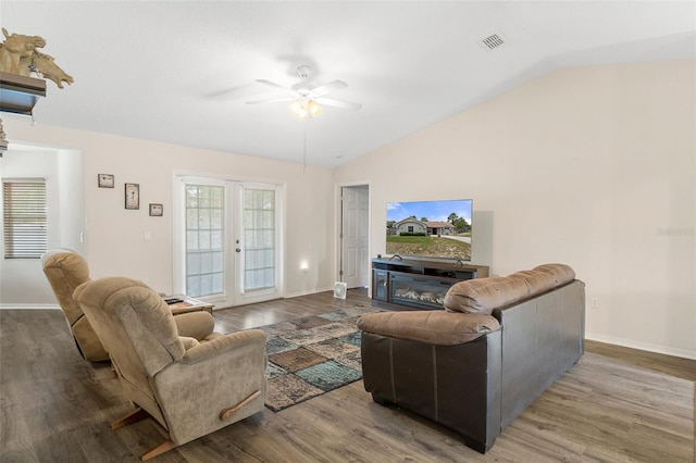 living room with lofted ceiling, wood-type flooring, ceiling fan, and french doors