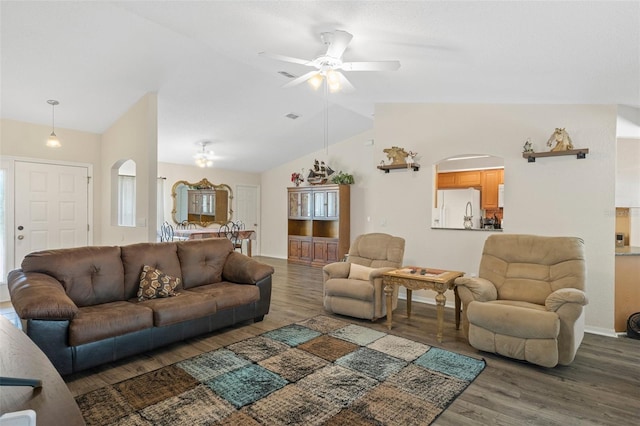 living room featuring ceiling fan, dark hardwood / wood-style flooring, and lofted ceiling