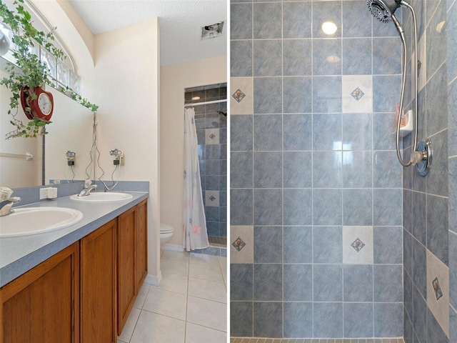 bathroom featuring curtained shower, a textured ceiling, tile patterned flooring, toilet, and vanity