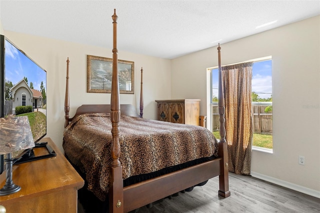 bedroom with light hardwood / wood-style flooring