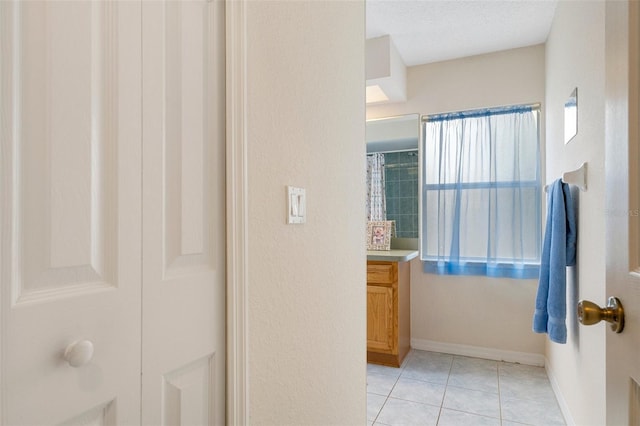 bathroom with tile patterned floors, vanity, and a shower with curtain