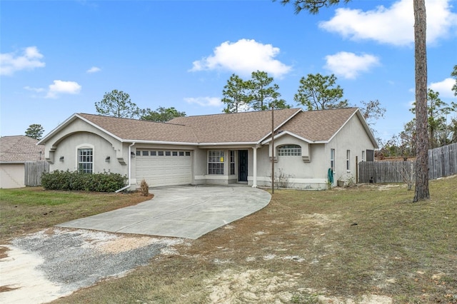 single story home featuring a front yard and a garage