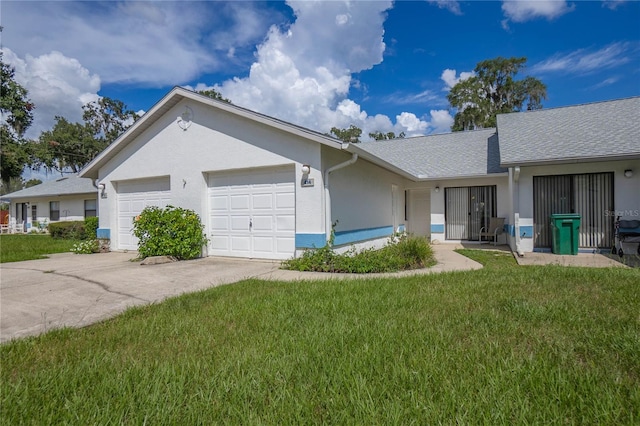 view of front of property with a garage and a front yard