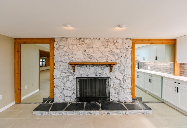 details featuring backsplash and a fireplace