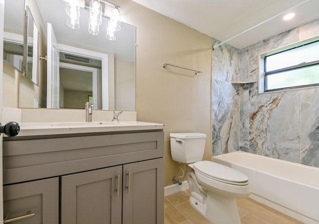 full bathroom with vanity, tiled shower / bath combo, tile patterned floors, and toilet