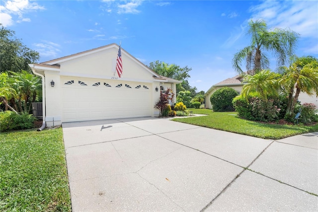 ranch-style home with cooling unit, a front lawn, and a garage