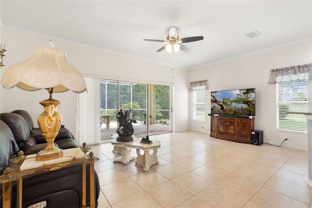 tiled living room with ceiling fan and ornamental molding