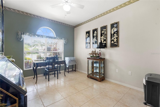 tiled office featuring ceiling fan