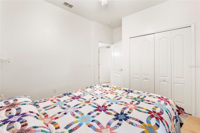 bedroom featuring ceiling fan and a closet