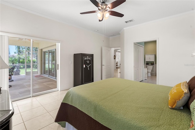 bedroom featuring light tile patterned floors, ensuite bath, access to exterior, ceiling fan, and ornamental molding