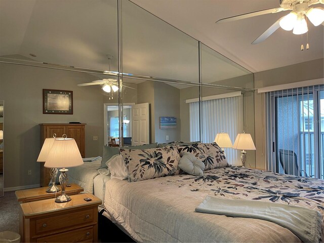 bedroom with ceiling fan, vaulted ceiling, and carpet floors