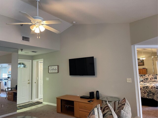 living room featuring lofted ceiling, carpet flooring, and ceiling fan