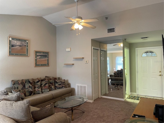 living room featuring ceiling fan, carpet, and vaulted ceiling