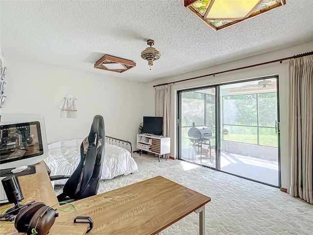 home office with a textured ceiling and carpet