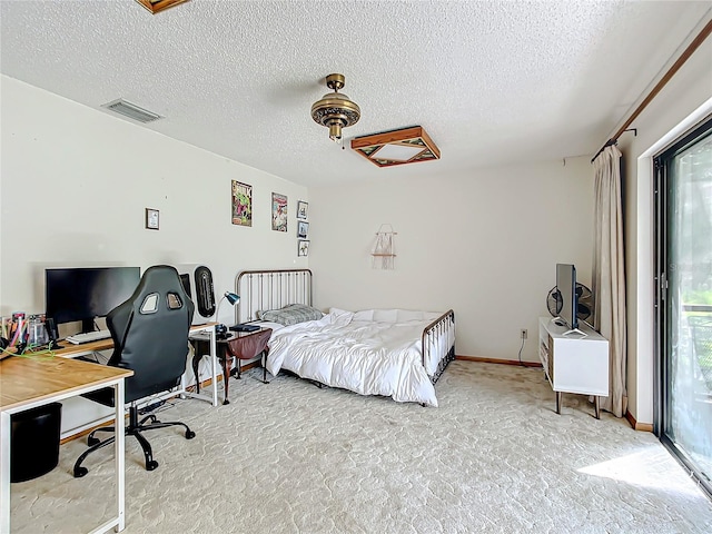 carpeted bedroom featuring ceiling fan, a textured ceiling, and access to outside