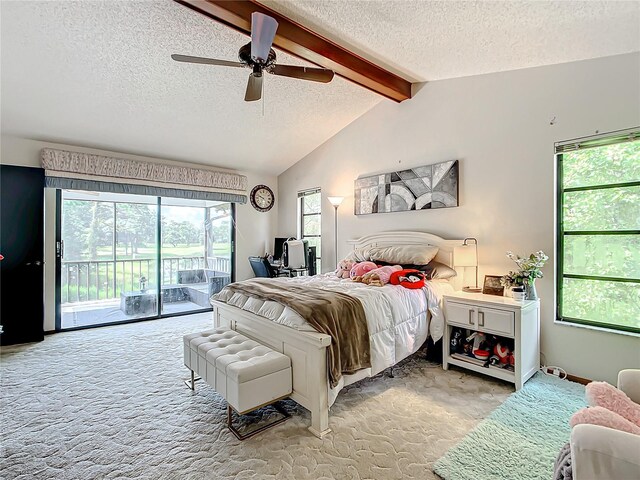 carpeted bedroom with ceiling fan, a textured ceiling, access to outside, and vaulted ceiling with beams