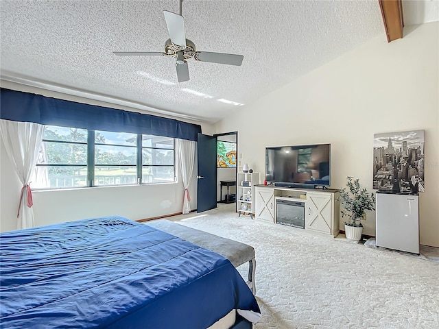 carpeted bedroom with ceiling fan, a textured ceiling, and lofted ceiling with beams