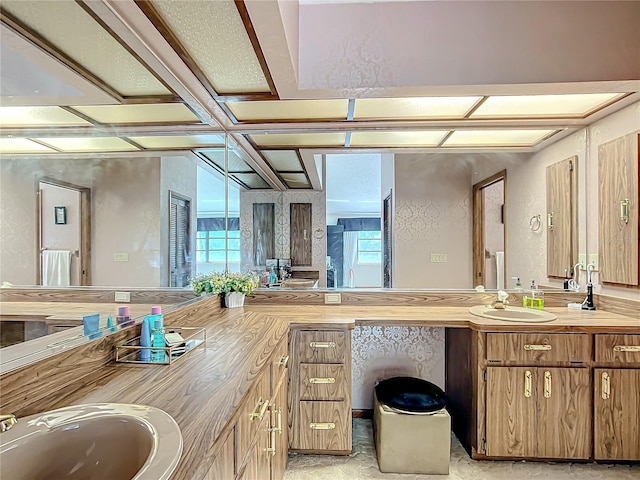 bathroom featuring coffered ceiling and vanity