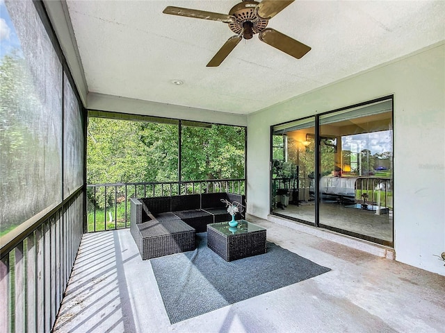 sunroom / solarium featuring ceiling fan