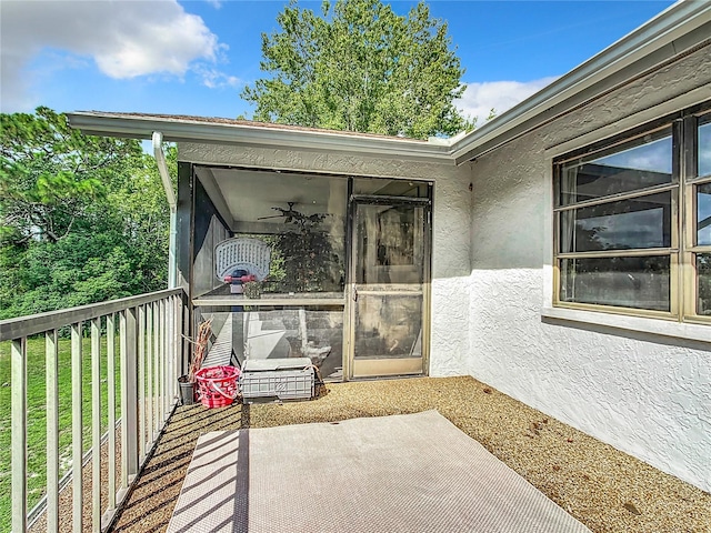 view of patio featuring ceiling fan