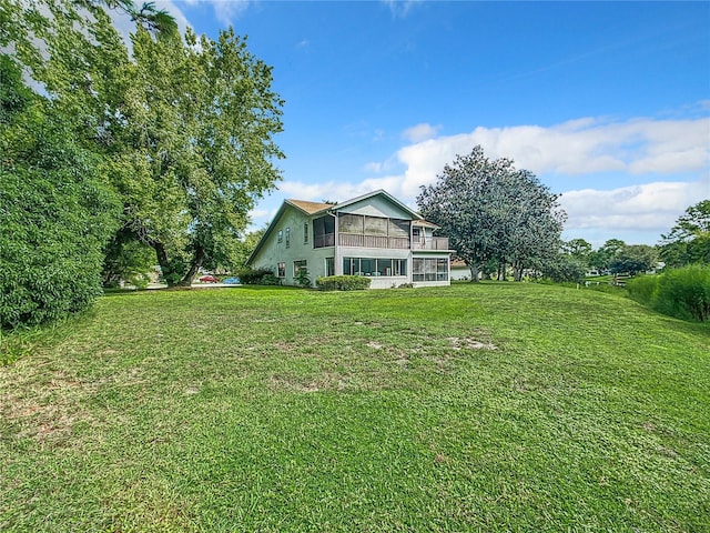 view of yard with a sunroom