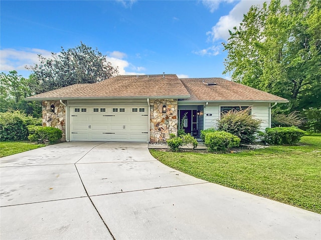 ranch-style home with a garage and a front yard