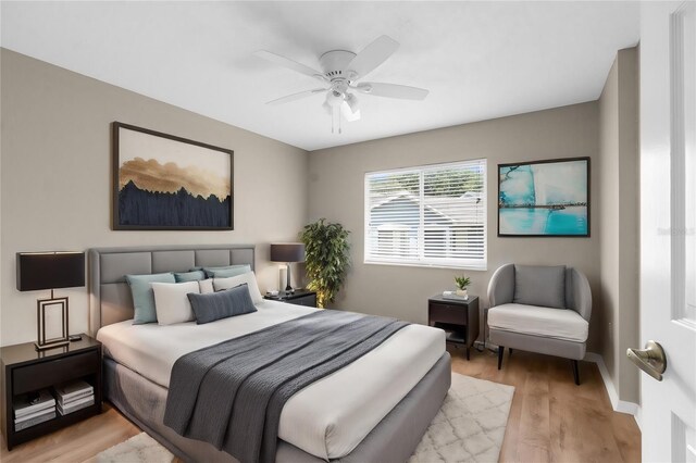 bedroom featuring light hardwood / wood-style floors and ceiling fan