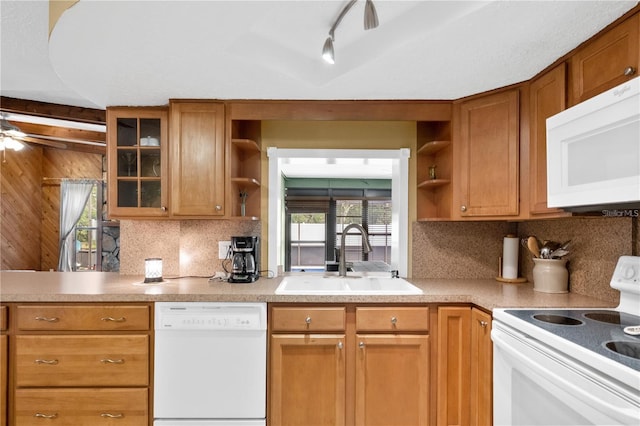 kitchen with white appliances, sink, ceiling fan, and decorative backsplash