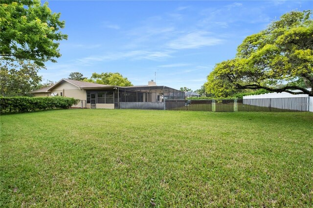 view of yard with a sunroom